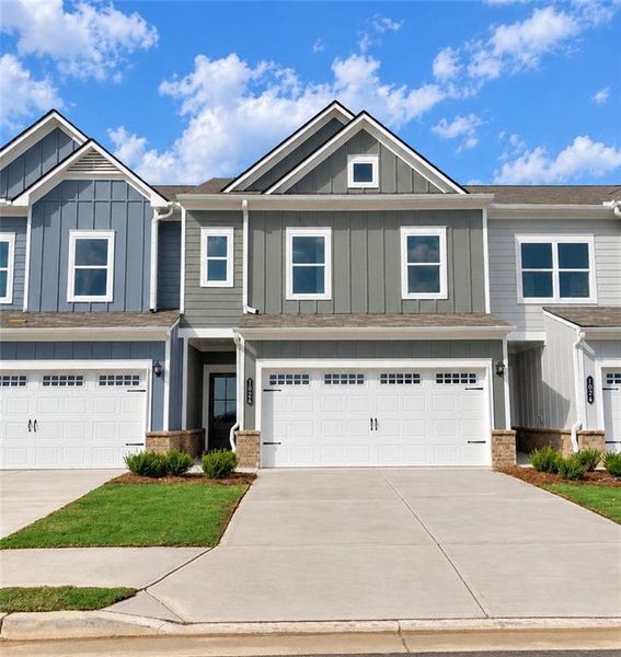 Front exterior of a new home in Townes At The Stiles, Cartersville, GA, highlighting curb appeal (Image 1). Front exterior of a new home in Townes At The Stiles, Cartersville, GA, highlighting curb appeal (Image 1).