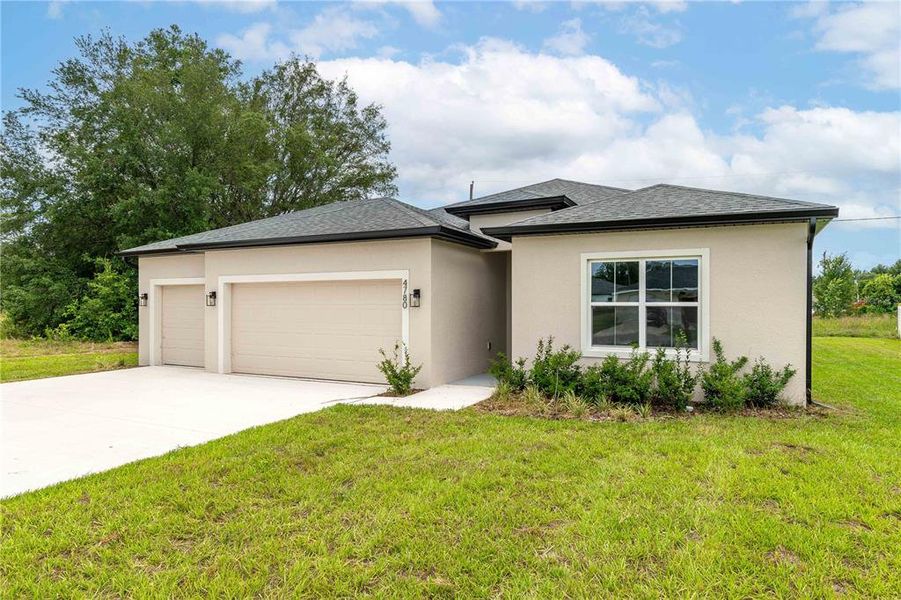 Front exterior of a new home in , Ocala, FL, highlighting curb appeal (Image 22).