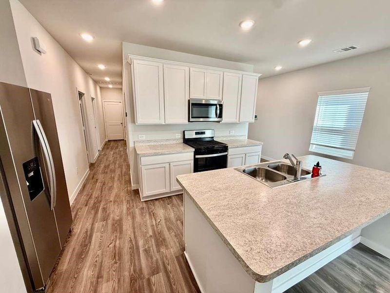 Furnished interior view inside a new home in Barrett Crossing, Crosby (Image 6).