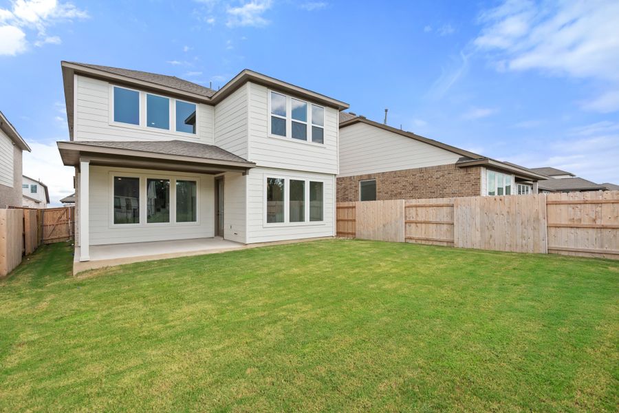 Exterior details and patio area of a home in Lariat, Liberty Hill (Image 30).