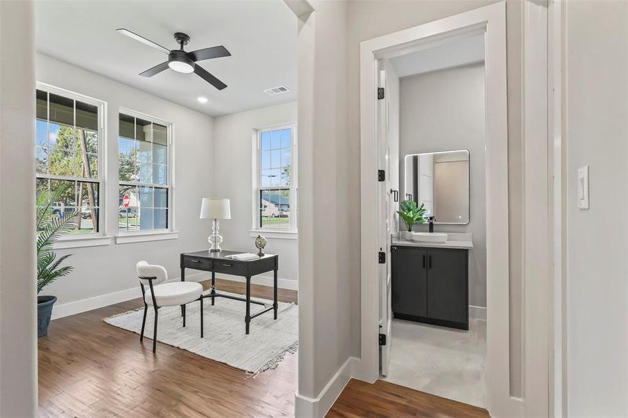 Office with wood finished floors, ceiling fan, and recessed lighting Office with wood finished floors, ceiling fan, and recessed lighting