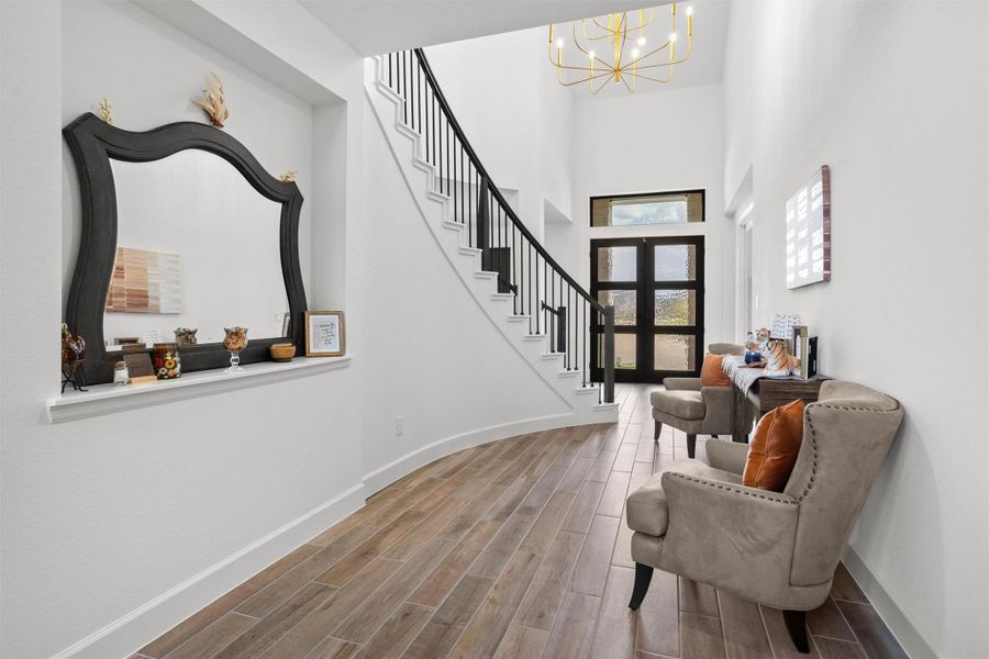 Light-filled foyer with dramatic staircase