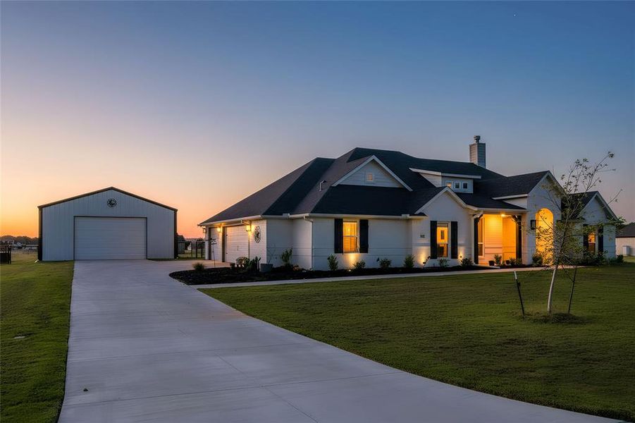 Modern farmhouse with a front yard and a chimney