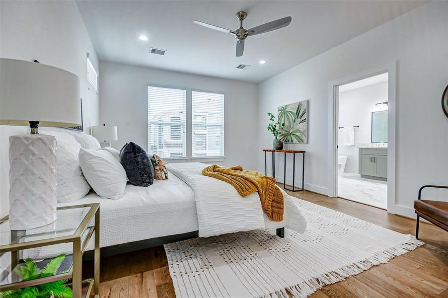 Master bedroom has real hardwood floors.