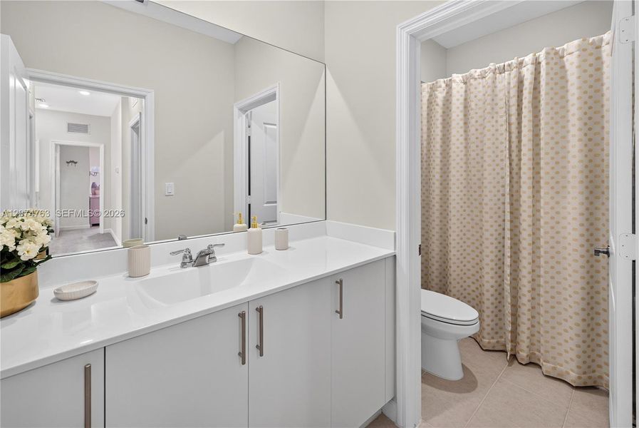 Furnished interior view inside a new home in Acacia Groves, Miami (Image 17).