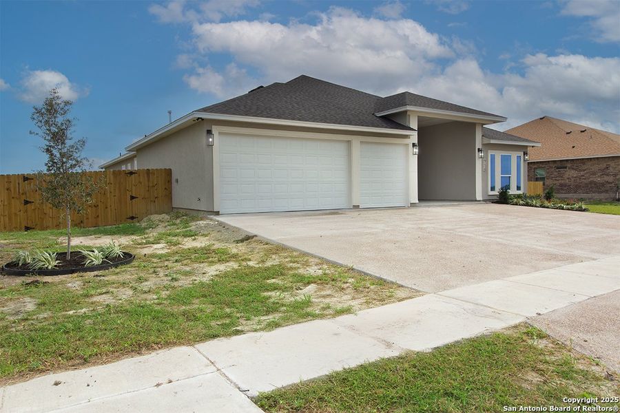 Front exterior of a new home in , Corpus Christi, TX, highlighting curb appeal (Image 2).