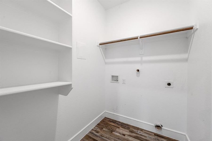 Laundry area featuring hookup for a washing machine, dark wood finished floors, hookup for an electric dryer, and hookup for a gas dryer Laundry area featuring hookup for a washing machine, dark wood finished floors, hookup for an electric dryer, and hookup for a gas dryer