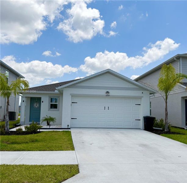 Front exterior of a new home in , Fort Myers, FL, highlighting curb appeal (Image 2). Front exterior of a new home in , Fort Myers, FL, highlighting curb appeal (Image 2).