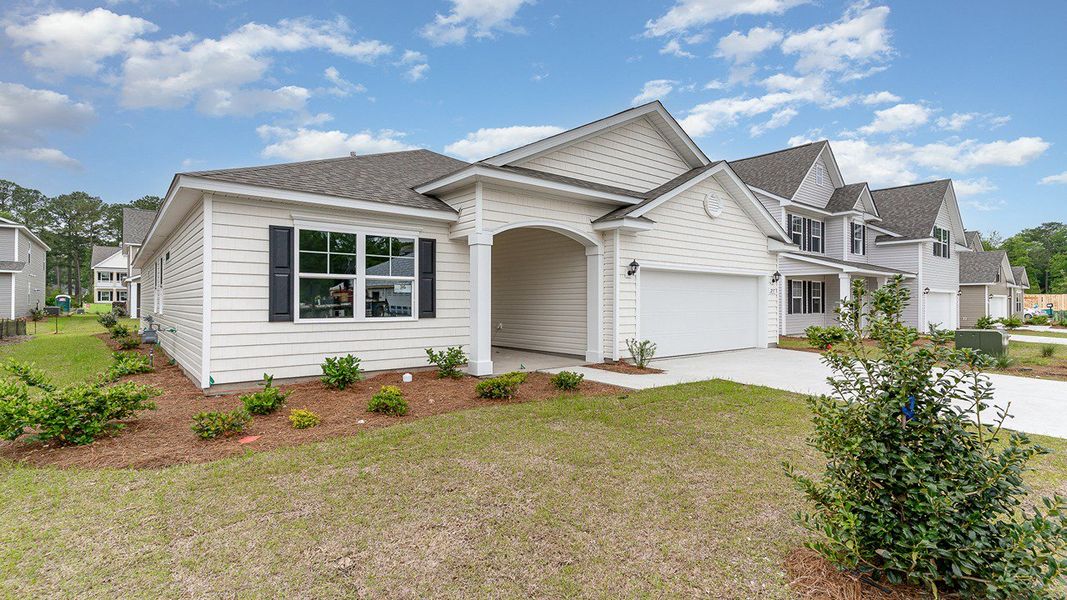 Representative exterior photo of a completed home built from the EATON by D.R. Horton in Spring View Landing, Loris, SC (Image 2).