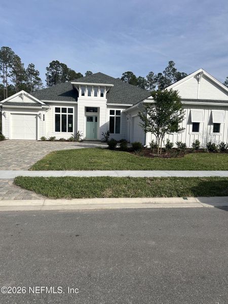 Front exterior of a new home in SilverLeaf, St. Augustine, FL, highlighting curb appeal (Image 1). Front exterior of a new home in SilverLeaf, St. Augustine, FL, highlighting curb appeal (Image 1).