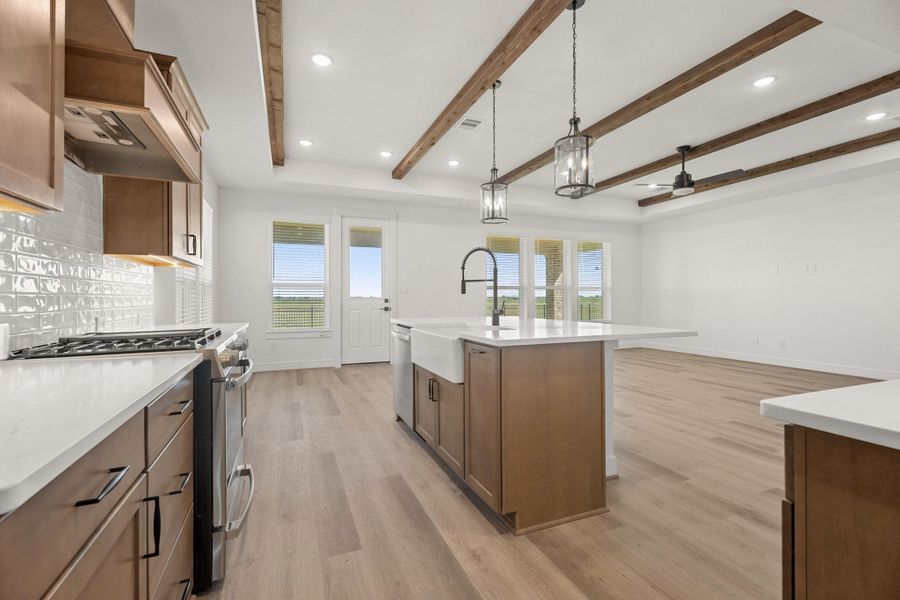 Truly a chef's delight, this dream kitchen boasts a spacious island, cabinet & counterspace galore, and stainless applianes. Truly a chef's delight, this dream kitchen boasts a spacious island, cabinet & counterspace galore, and stainless applianes.