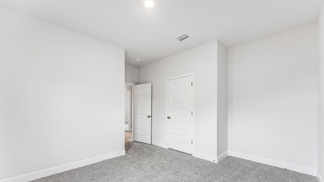 Representative unfurnished interior of a home built from the The Victoria by D.R. Horton in Hodges Bayou Plantation, Panama City (Image 25).