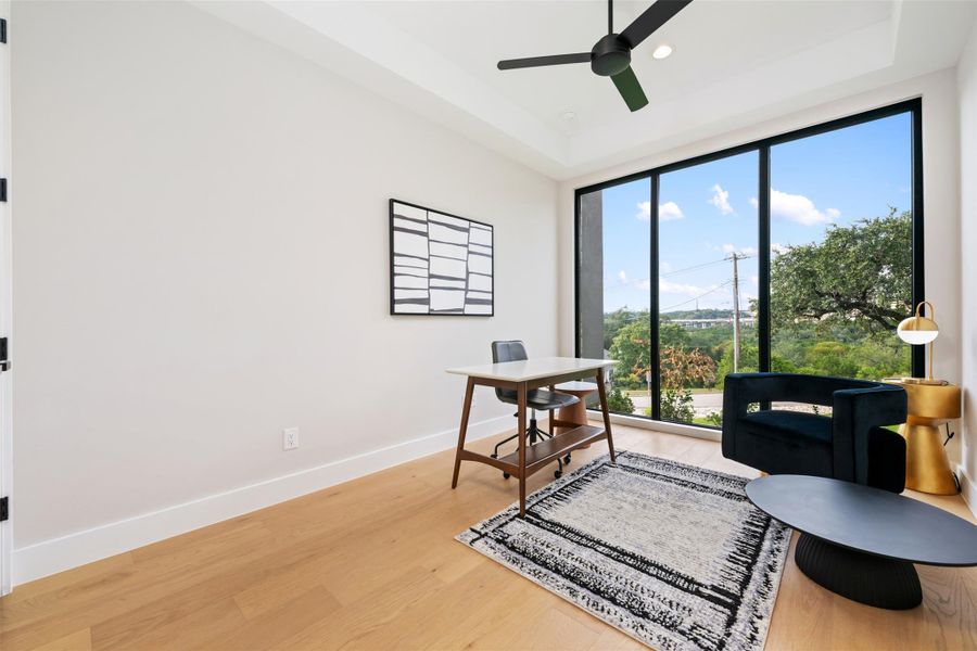 Enjoy the view while working in this spacious study with closet and wall to ceiling windows . Enjoy the view while working in this spacious study with closet and wall to ceiling windows .