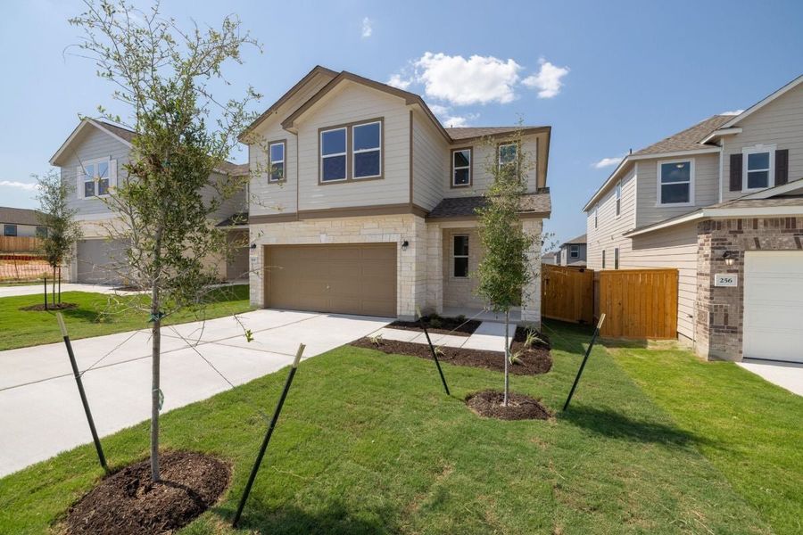 Front exterior of a new home in Sonterra - Cool Water, Jarrell, TX, highlighting curb appeal (Image 2). Front exterior of a new home in Sonterra - Cool Water, Jarrell, TX, highlighting curb appeal (Image 2).