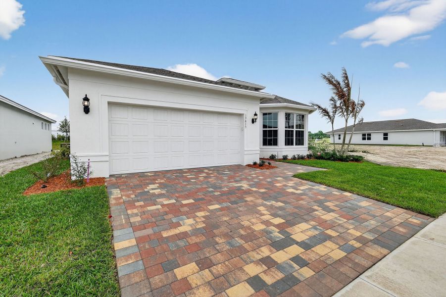 Exterior details and patio area of a home in Del Webb Tradition, Port St. Lucie (Image 3).