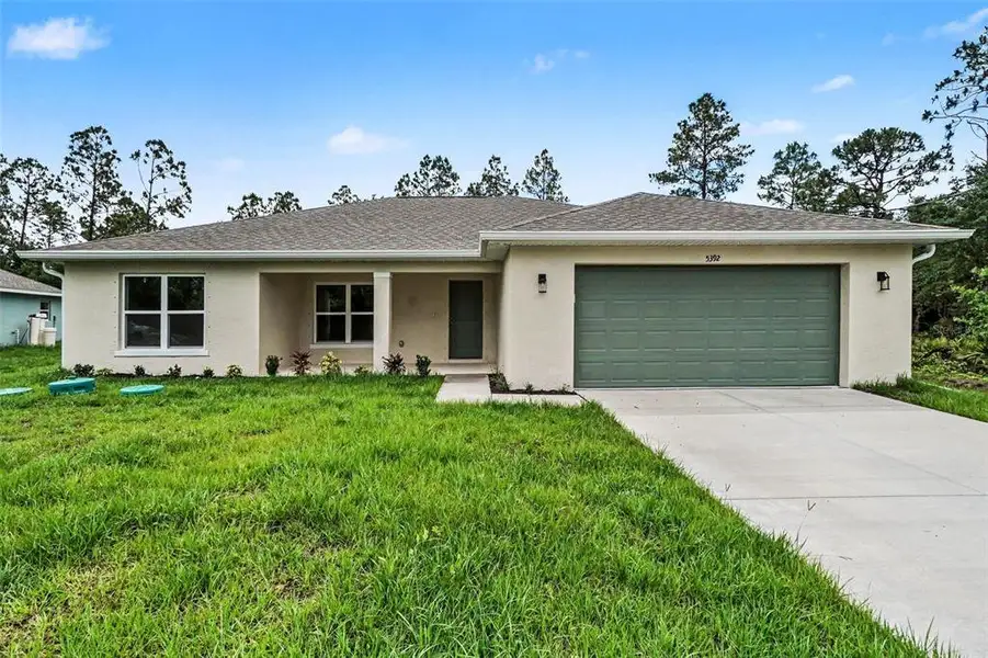 Front exterior of a new home in , North Port, FL, highlighting curb appeal (Image 1). Front exterior of a new home in , North Port, FL, highlighting curb appeal (Image 1).