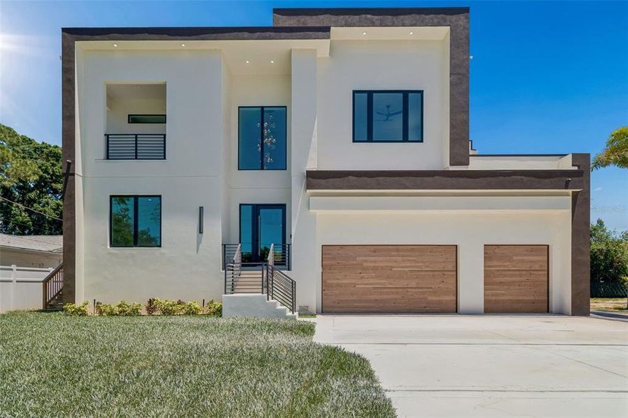 Front exterior of a new home in , Tampa, FL, highlighting curb appeal (Image 27).