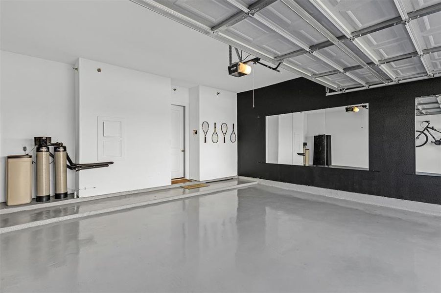 Garage featuring a garage door opener