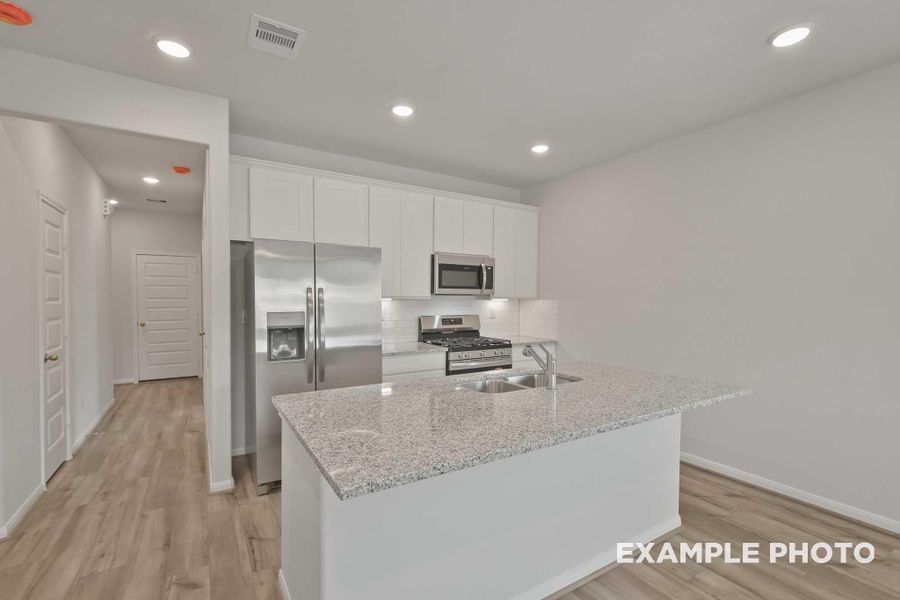 Furnished interior view inside a new home in Spring Branch Crossing, Conroe (Image 7).