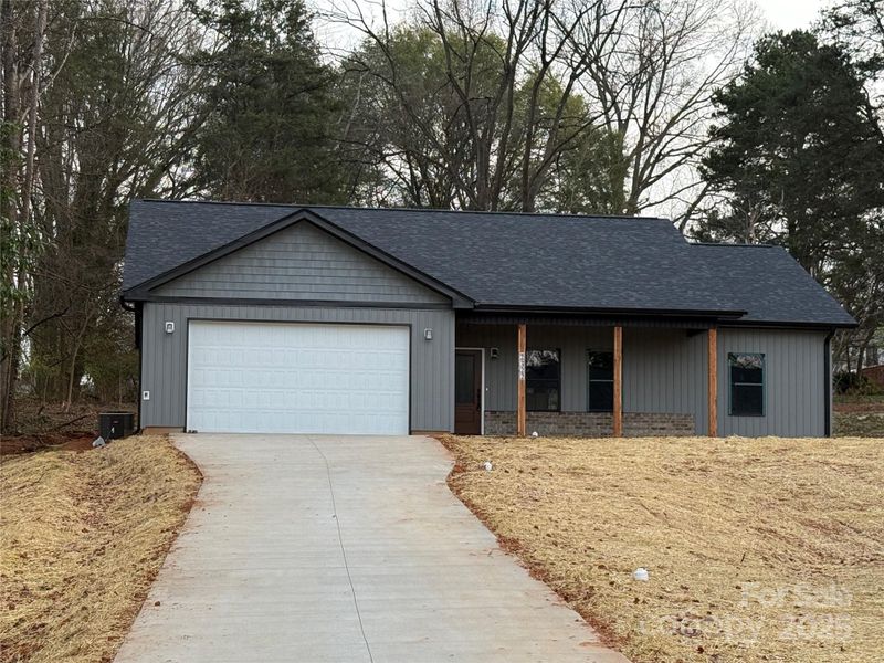 Front exterior of a new home in , Winston-Salem, NC, highlighting curb appeal (Image 1).