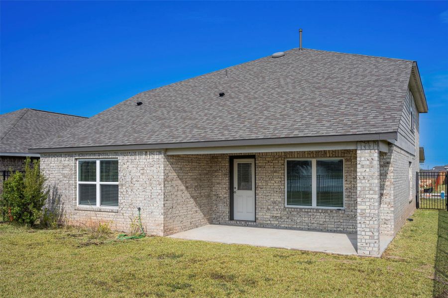Exterior details and patio area of a home in Sunterra, Katy (Image 21).