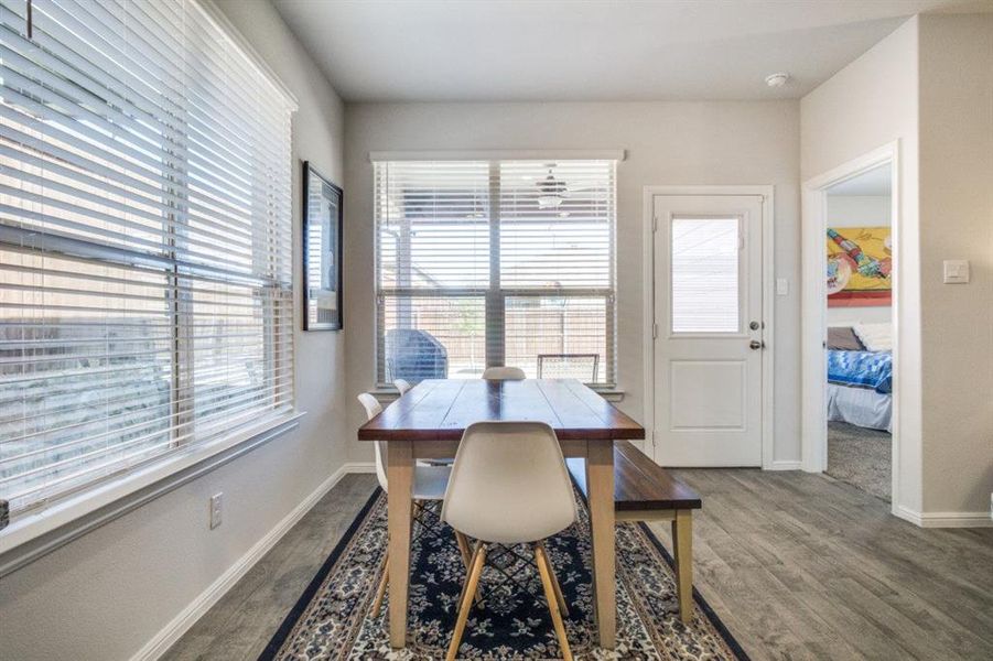 Dining room with plenty of natural light and wood finished floors