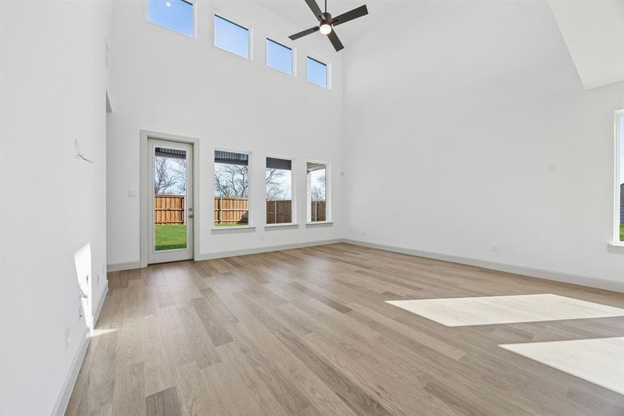 Your new family room is flooded with natural light from a dual stacked wall of windows! Your new family room is flooded with natural light from a dual stacked wall of windows!