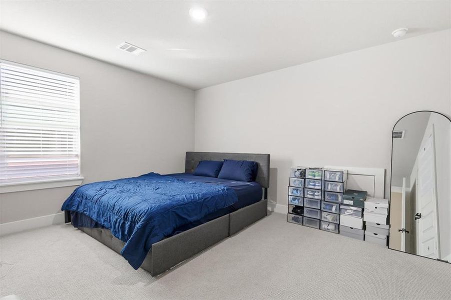 Bedroom with carpet flooring and recessed lighting