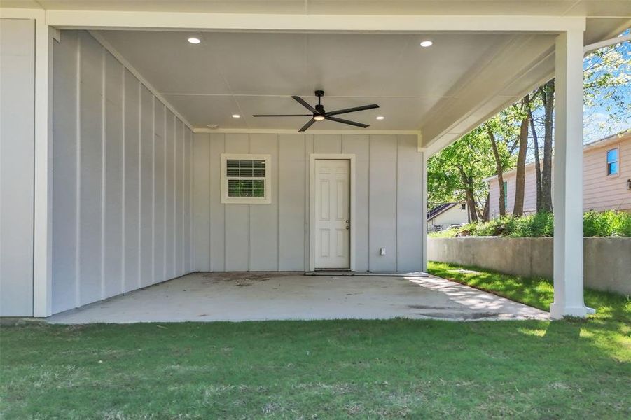 Grand oversized patio with tall ceiling and resort fan
