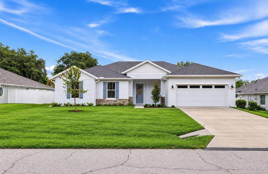 Front exterior of a new home in , Palm Coast, FL, highlighting curb appeal (Image 2). Front exterior of a new home in , Palm Coast, FL, highlighting curb appeal (Image 2).