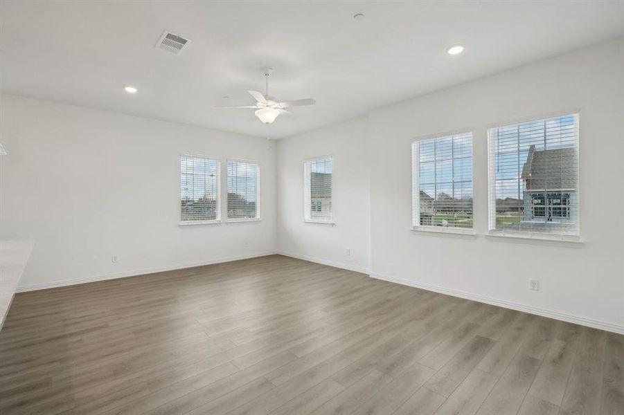 Empty room featuring light hardwood / wood-style floors and ceiling fan