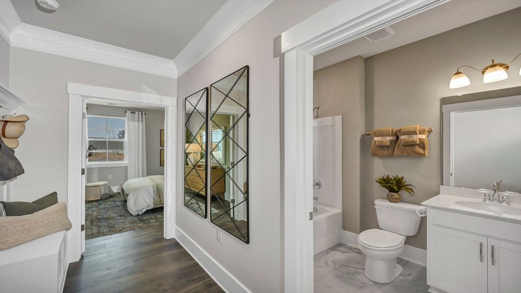Representative furnished interior of a home built from the Harbor Oak by D.R. Horton in Lake Tide Summit, Chapin (Image 30).