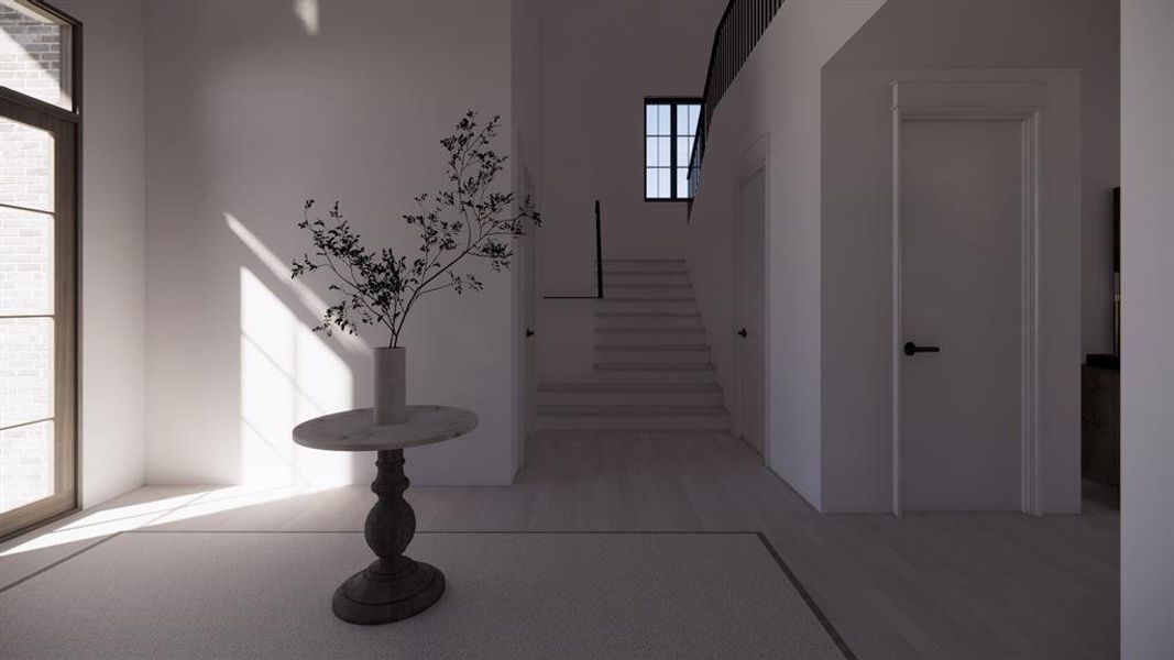 Entryway featuring stairs and light wood-type flooring