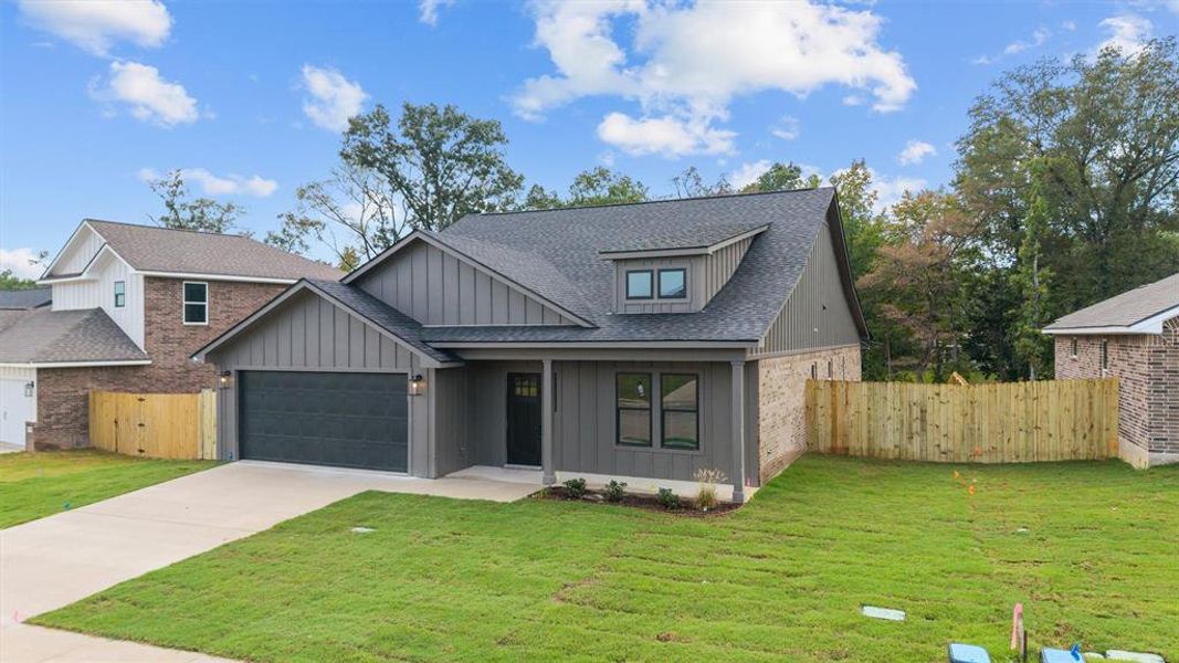 Front exterior of a new home in , Lindale, TX, highlighting curb appeal (Image 19). Front exterior of a new home in , Lindale, TX, highlighting curb appeal (Image 19).