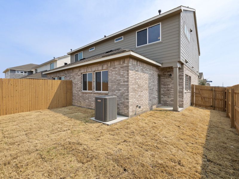 Exterior details and patio area of a home in Saddle Creek Twinhomes, Georgetown (Image 4).