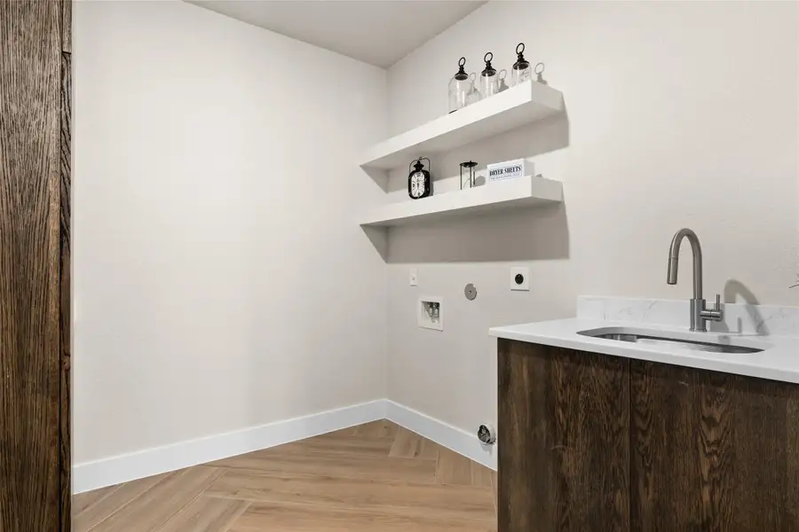 Laundry room with hookup for a gas dryer, washer hookup, and hookup for an electric dryer