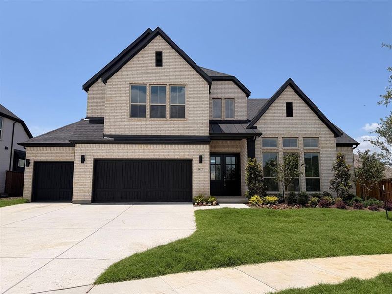Front exterior of a new home in Estates at Rockhill, Frisco, TX, highlighting curb appeal (Image 19). Front exterior of a new home in Estates at Rockhill, Frisco, TX, highlighting curb appeal (Image 19).