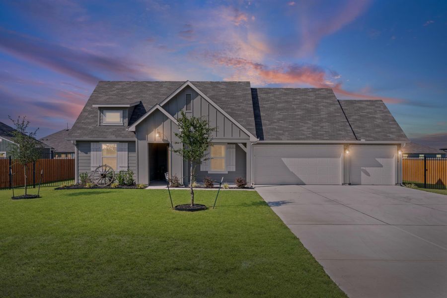 Front exterior of a new home in Hartland Ranch, Lockhart, TX, highlighting curb appeal (Image 1). Front exterior of a new home in Hartland Ranch, Lockhart, TX, highlighting curb appeal (Image 1).