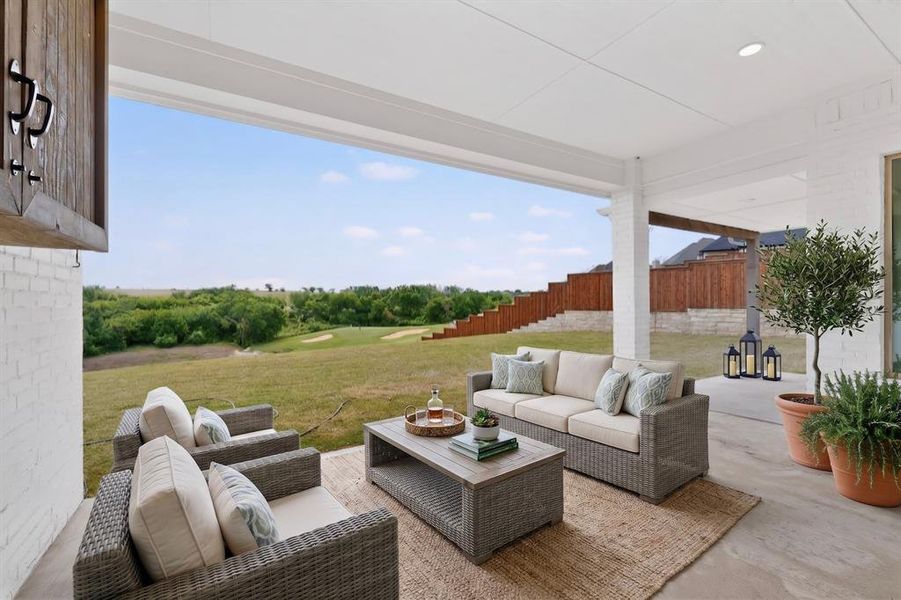 Covered patio featuring a solid ceiling, white brick exterior, and concrete flooring Covered patio featuring a solid ceiling, white brick exterior, and concrete flooring