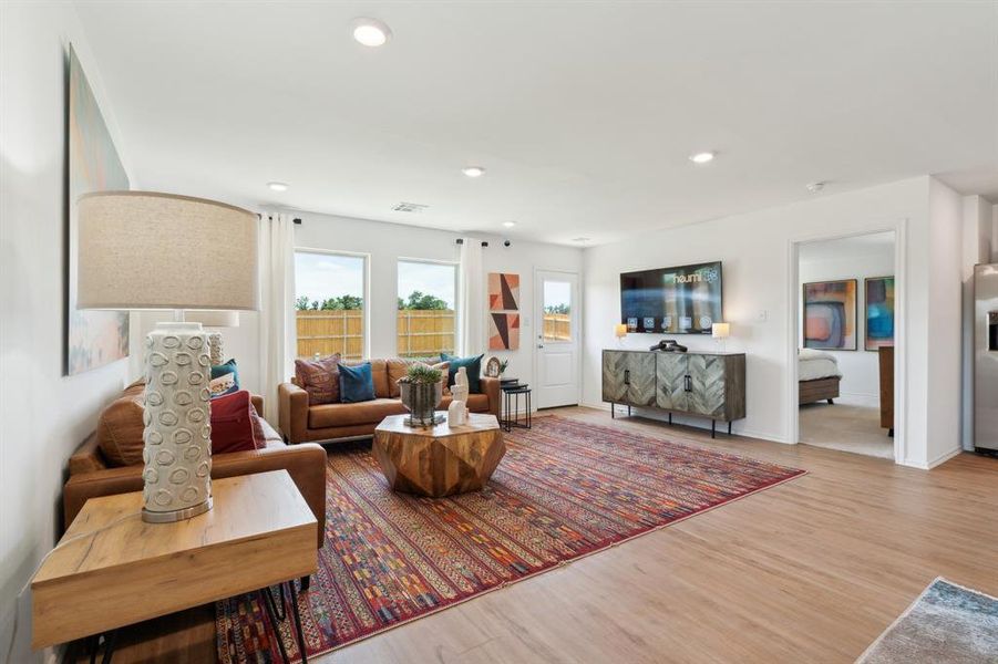 Living room with light hardwood / wood-style flooring