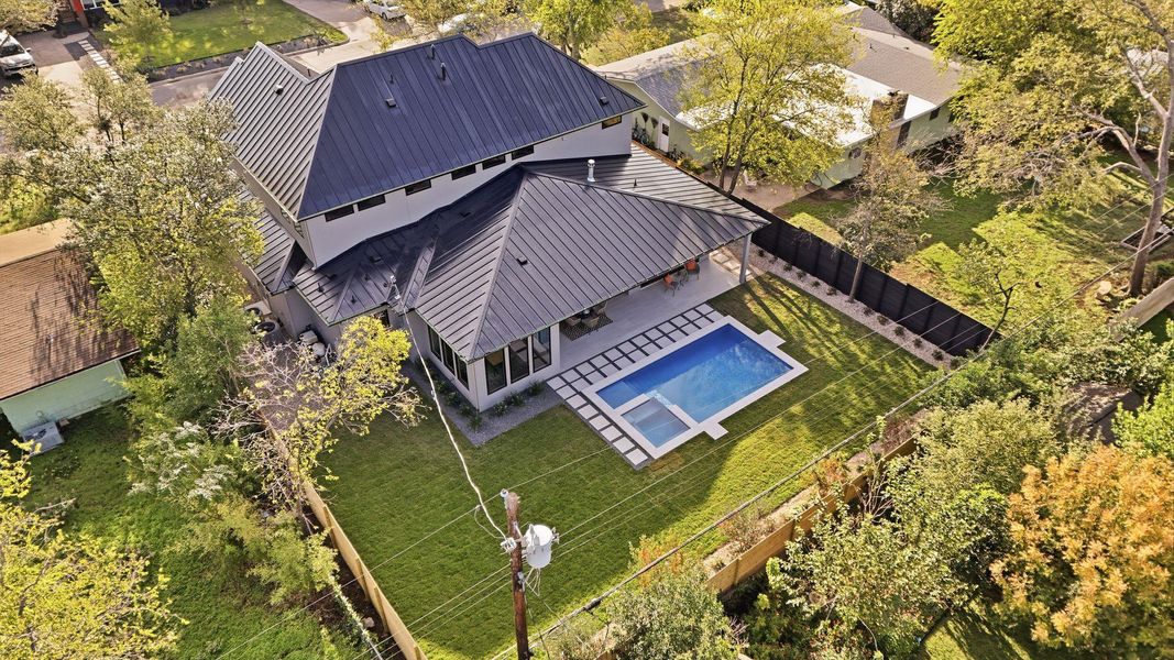 View from above of property featuring a pool area View from above of property featuring a pool area