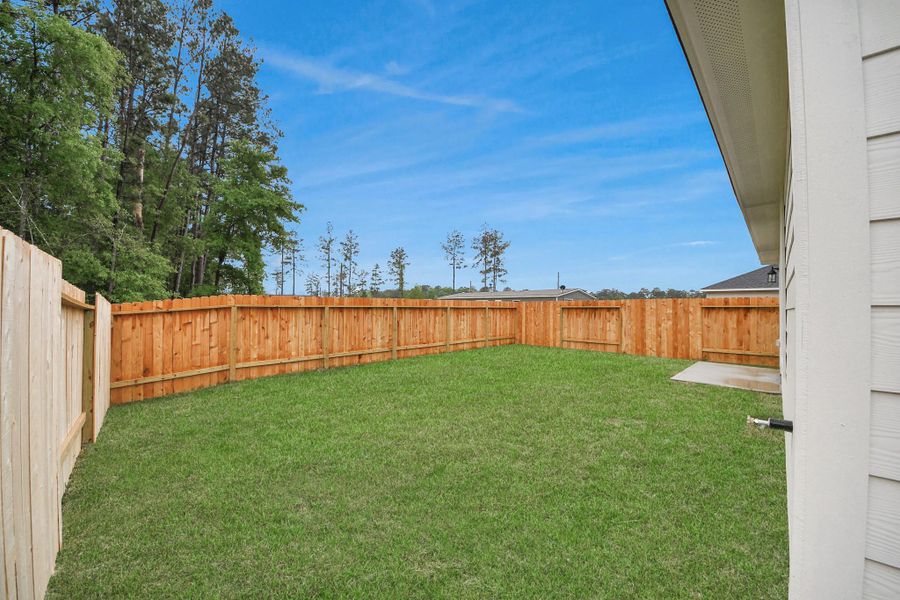 Exterior details and patio area of a home in The Enclave at Spring Branch, Montgomery (Image 24). Exterior details and patio area of a home in The Enclave at Spring Branch, Montgomery (Image 24).