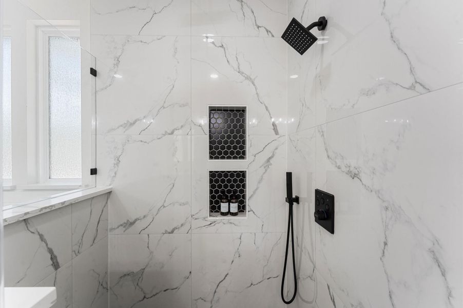 Spa-inspired bath with walk-in shower, soaking tub, double vanities, quartz counters, and luxury finishes. Spa-inspired bath with walk-in shower, soaking tub, double vanities, quartz counters, and luxury finishes.