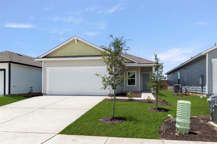 View of front of property featuring a garage, a front lawn, and driveway View of front of property featuring a garage, a front lawn, and driveway