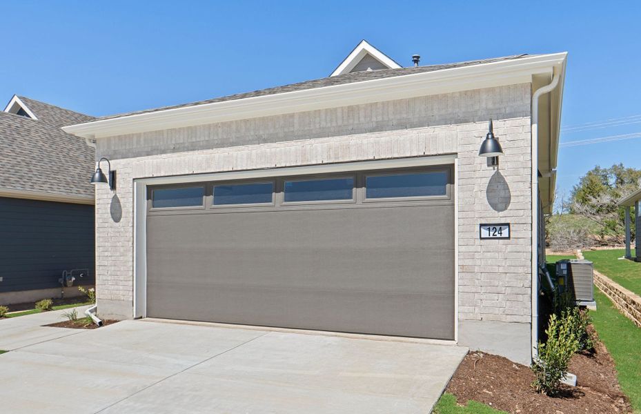 Front exterior of a new home in Sun City Texas, Georgetown, TX, highlighting curb appeal (Image 20).