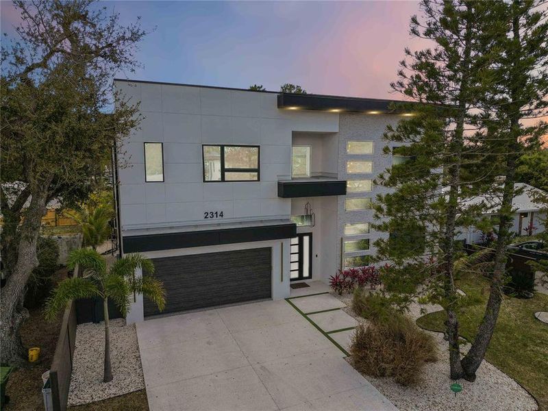 Front exterior of a new home in , Sarasota, FL, highlighting curb appeal (Image 2).