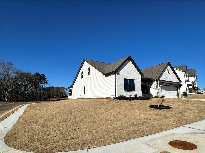 Front exterior of a new home in Summerlin, Winder, GA, highlighting curb appeal (Image 25).