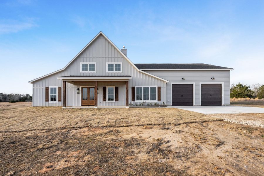 Front exterior of a new home in , New Waverly, TX, highlighting curb appeal (Image 25).