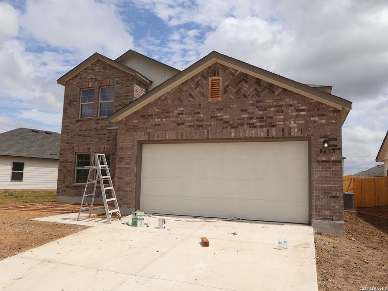 Front exterior of a new home in Cinco Lakes, San Antonio, TX, highlighting curb appeal (Image 2). Front exterior of a new home in Cinco Lakes, San Antonio, TX, highlighting curb appeal (Image 2).