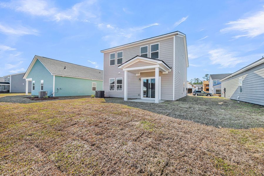 Exterior details and patio area of a home in , Ravenel (Image 18).